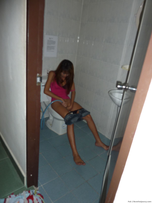 Sexy Thai bar girl parts her moist pussy before fucking a sex tourist