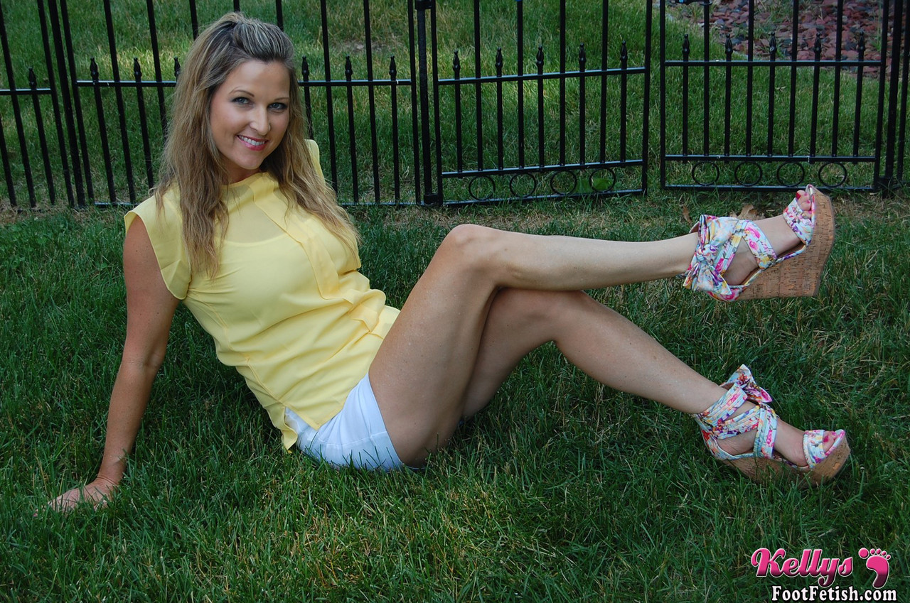 Non nude female Kelly Anderson displays her pretty feet on the lush grass photo porno #425680667