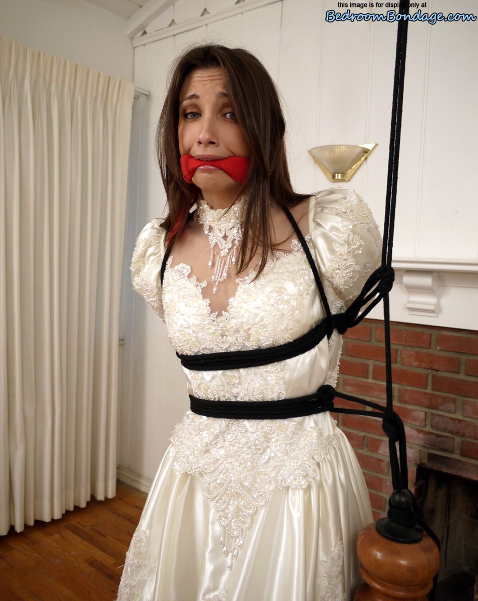 Brunette bride Celeste Star is ballgagged and tied up in her wedding dress porn photo #422563314