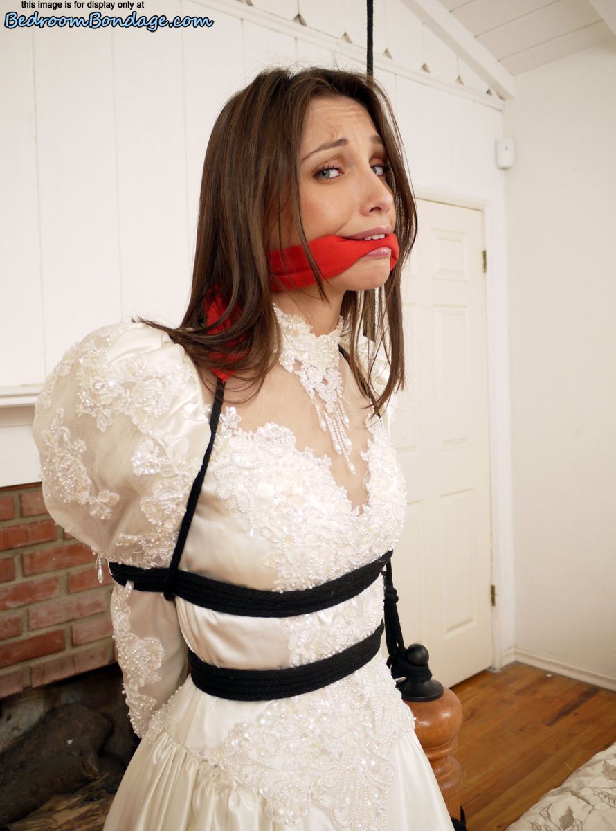Brunette bride Celeste Star is ballgagged and tied up in her wedding dress porn photo #422563318