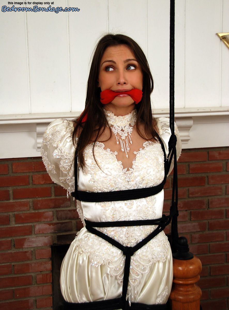 Brunette bride Celeste Star is ballgagged and tied up in her wedding dress porn photo #422563324
