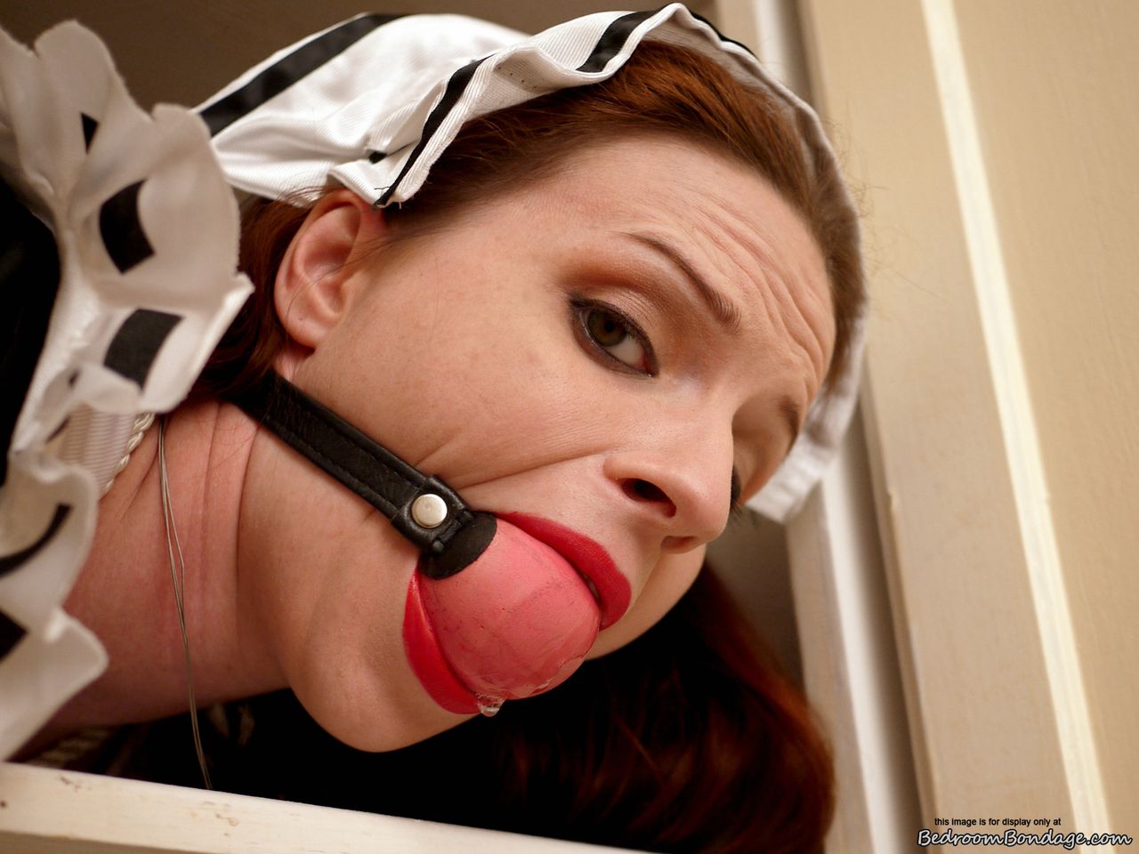Clever maid: Caucasian maid Claire Adams is ballgagged and bound in closets.