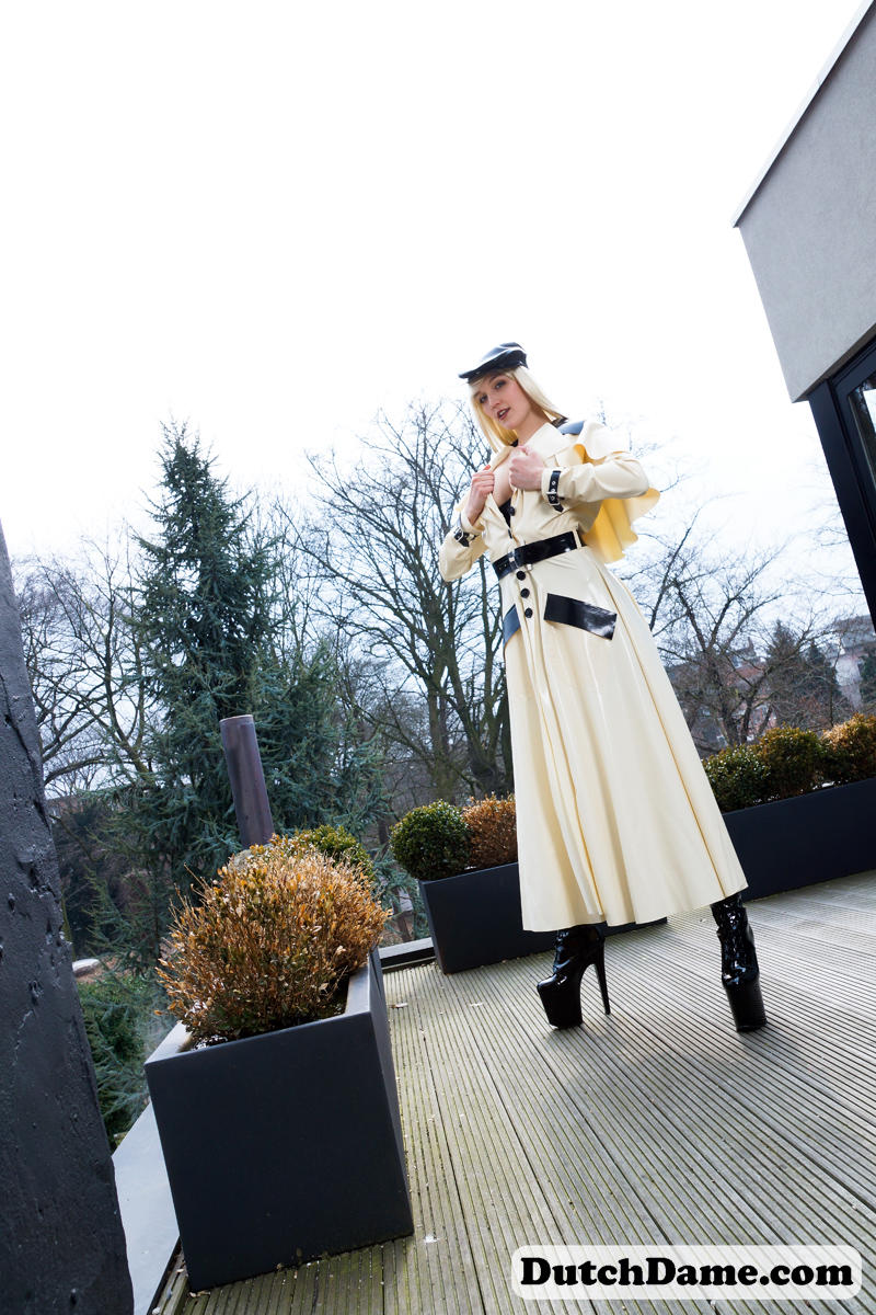 Classy blonde flashes the village below on her patio in latex attire ポルノ写真 #426969815