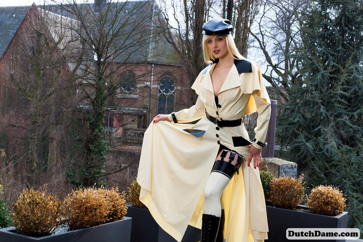 Classy blonde flashes the village below on her patio in latex attire ポルノ写真 #426969819
