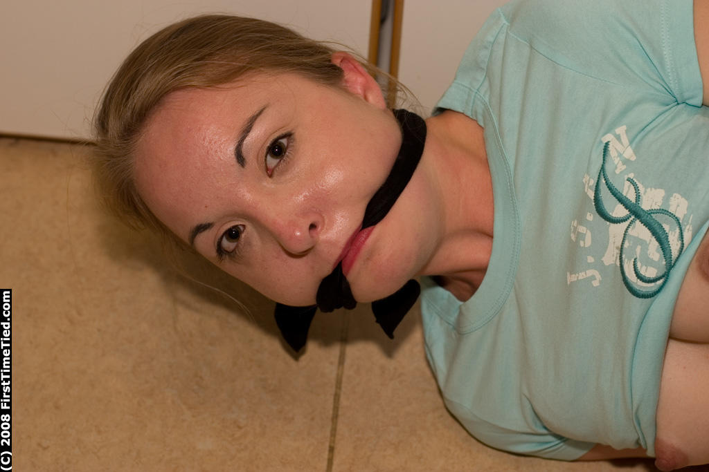 White girl is tied up and cuffed while ball gagged with pants pulled down porno fotoğrafı #428583857