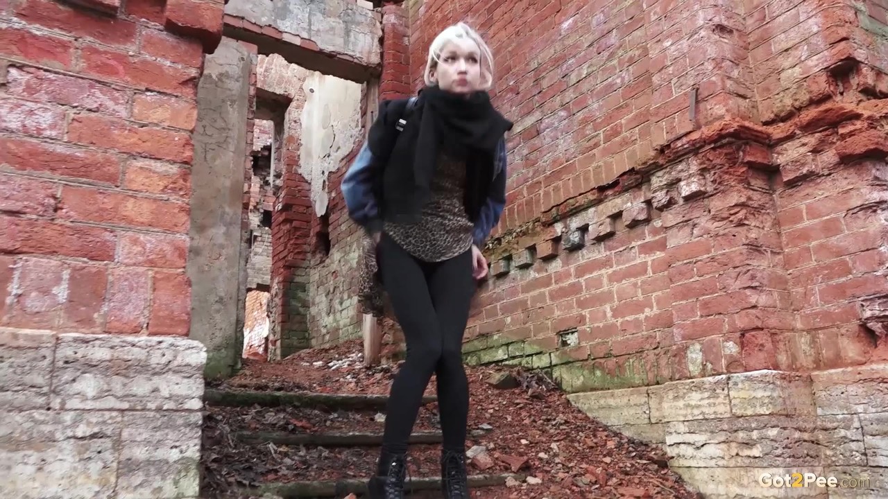 Pretty blonde Masha pulls down her tights for a piss by an abandoned building photo porno #427288065