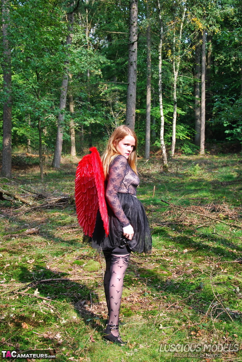 Amateur solo girl sports angel wings while modelling lingerie on a tree stump porno fotoğrafı #428731731