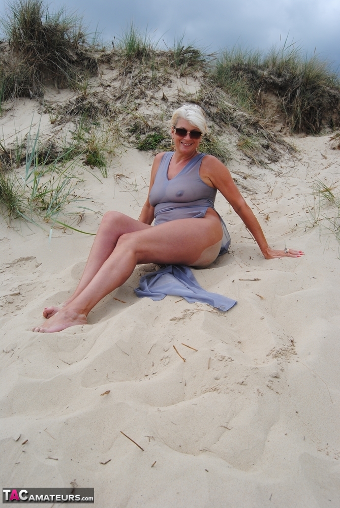 Mature platinum blonde Dimonty models at the beach in see through clothing foto porno #425316007