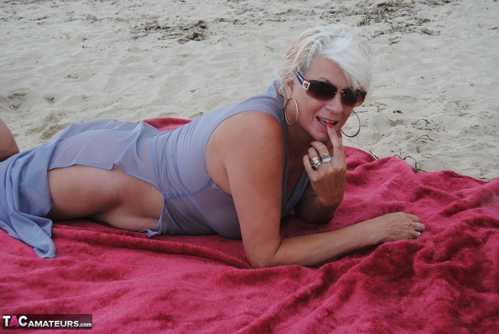 Mature platinum blonde Dimonty models at the beach in see through clothing porn photo #425316033