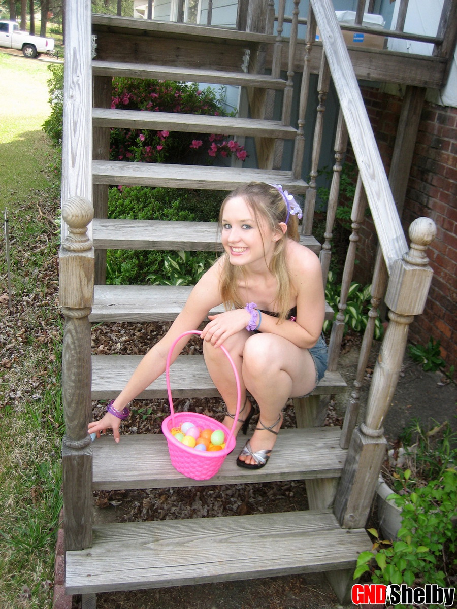 Charming young girl exposes a nipple while collecting Easter eggs photo porno #425462150