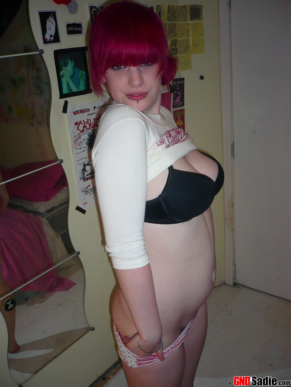 Amateur girl with pink hair uncovers her big natural tits while getting naked foto porno #428658328