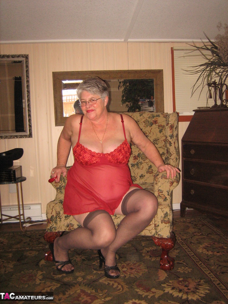 Old woman Girdle Goddess slips off red lingerie to get naked in stockings porn photo #428515654