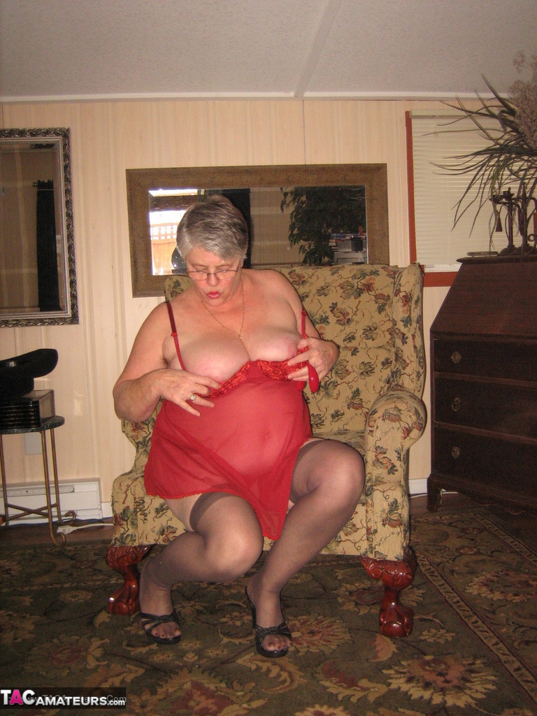 Old woman Girdle Goddess slips off red lingerie to get naked in stockings porno foto #428515674