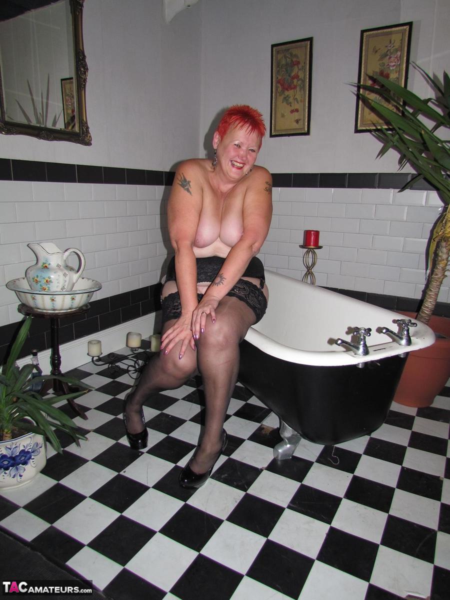 Older Redhead Valgasmic Exposed Steps Into A Bathtub While Wearing Stockings