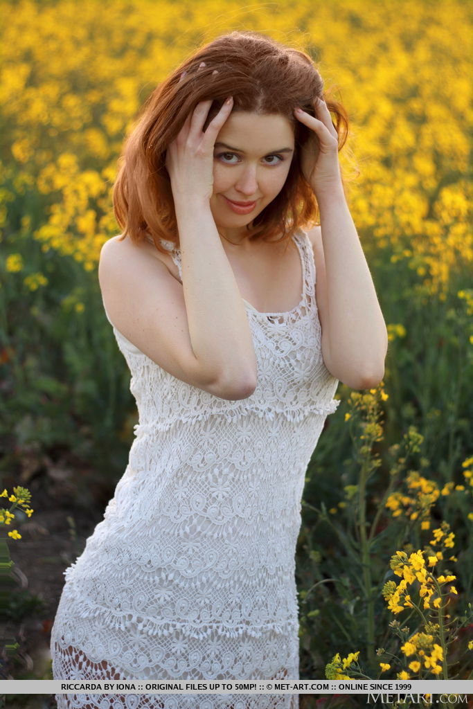 Young Redhead Riccarda Models In A Mustard Field Before Getting Naked