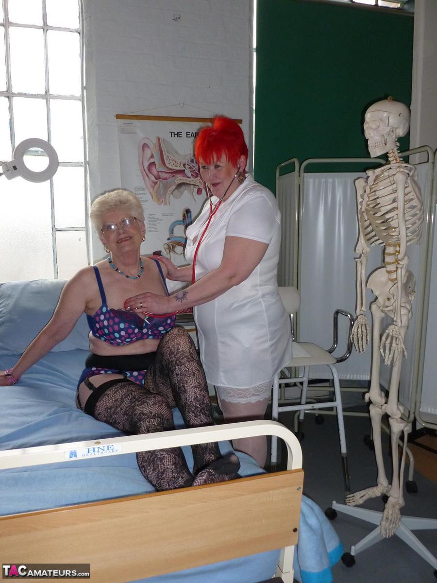 Redheaded nurse Valgasmic Exposed and a busty older lady play with a skeleton porn photo #423127144