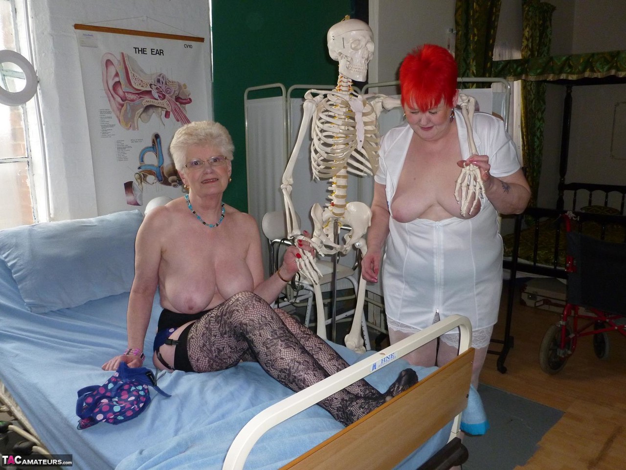 Redheaded nurse Valgasmic Exposed and a busty older lady play with a skeleton porn photo #423127219