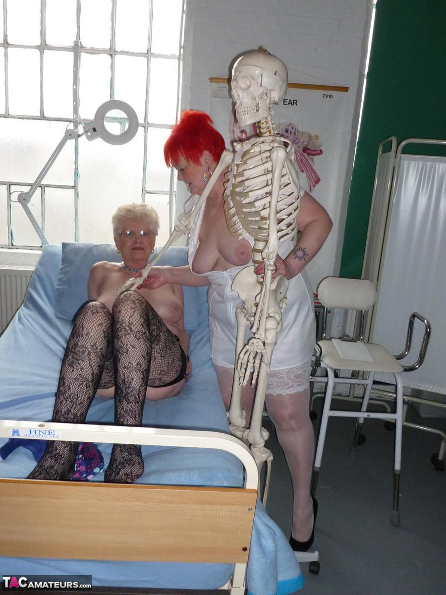Redheaded nurse Valgasmic Exposed and a busty older lady play with a skeleton photo porno #423127254