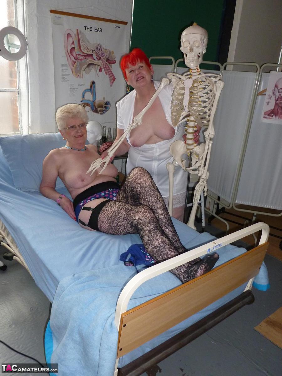 Redheaded nurse Valgasmic Exposed and a busty older lady play with a skeleton porn photo #423127270