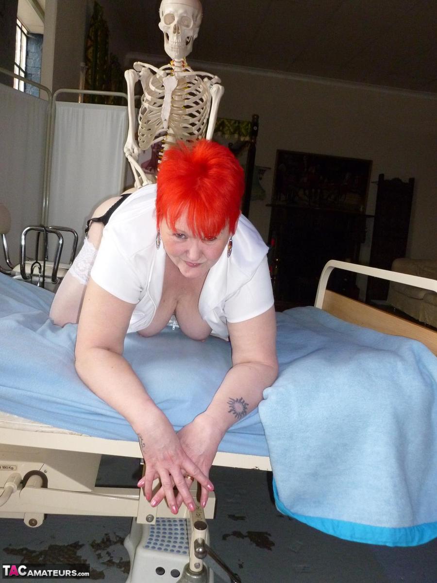 Older redhead nurse Valgasmic Exposed gets banged by a dildo wielding skeleton foto porno #425285445