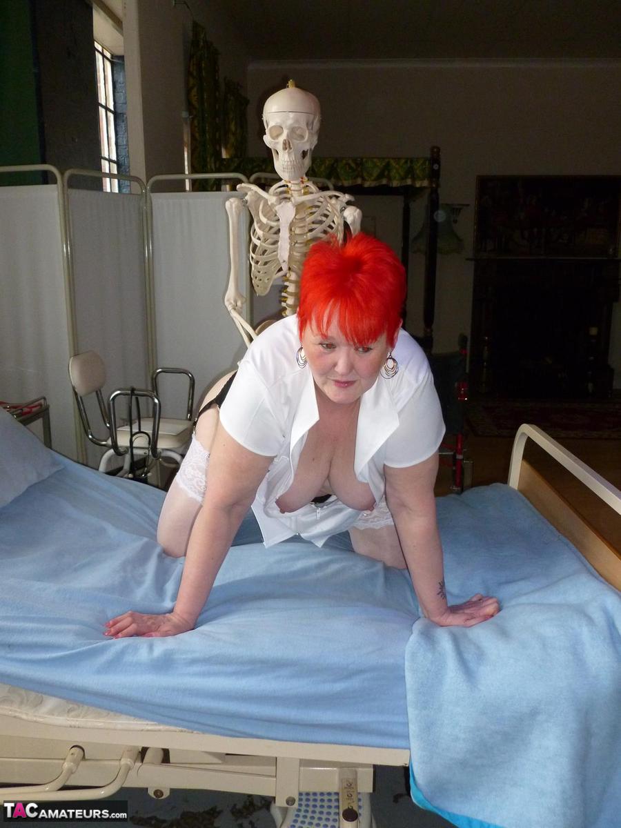 Older redhead nurse Valgasmic Exposed gets banged by a dildo wielding skeleton foto porno #425285450