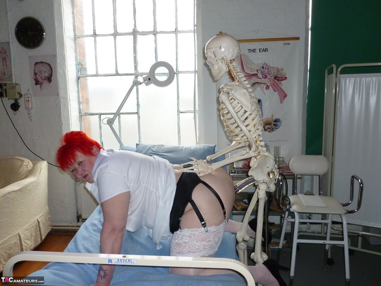 Older redhead nurse Valgasmic Exposed gets banged by a dildo wielding skeleton foto porno #425285467