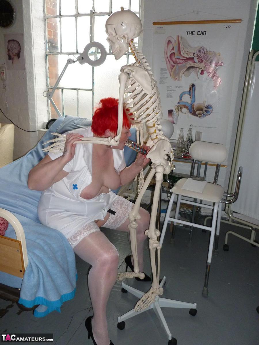 Vampir-wearing dildo and an inflatable are used to blow Valgasmic Exposed, an older redhead nurse.
