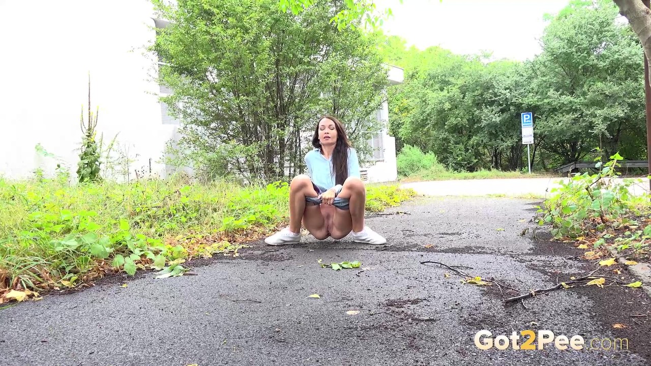 Dark haired Mistica needs to pee while in suburbs foto porno #427196487