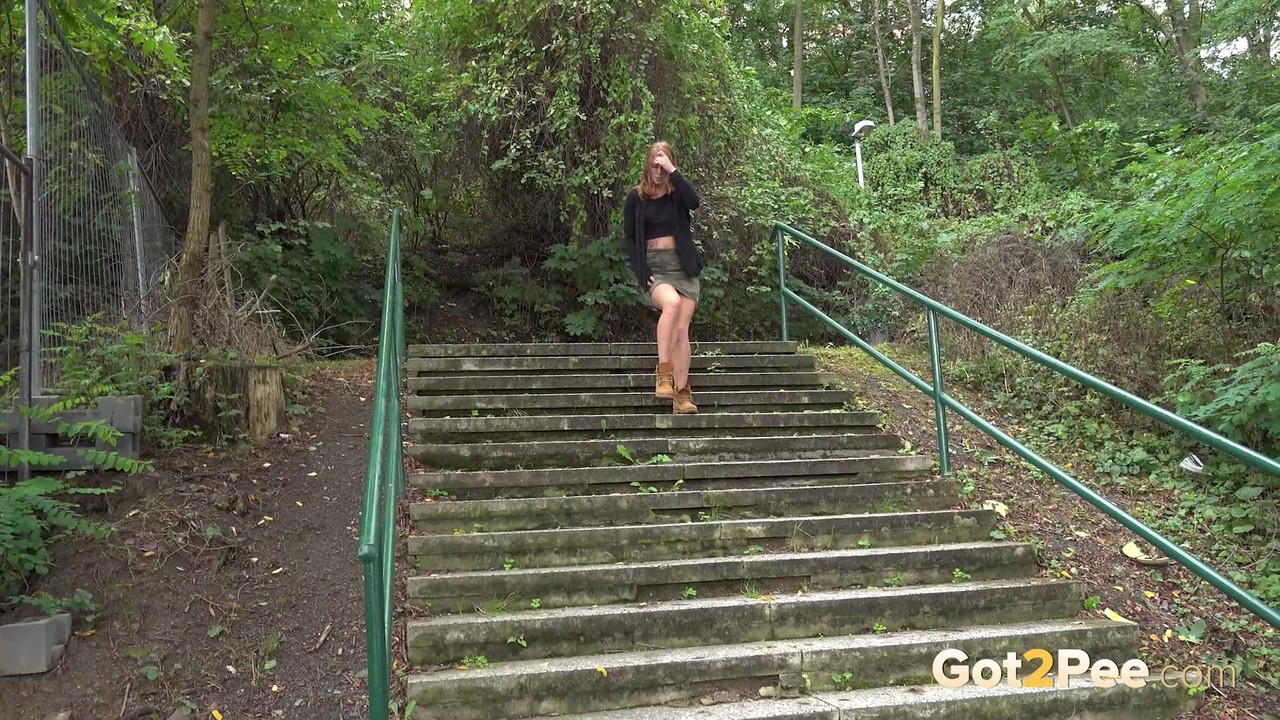 Natural redhead Chrissy Fox squats for a pee on a set of public steps foto porno #427250757