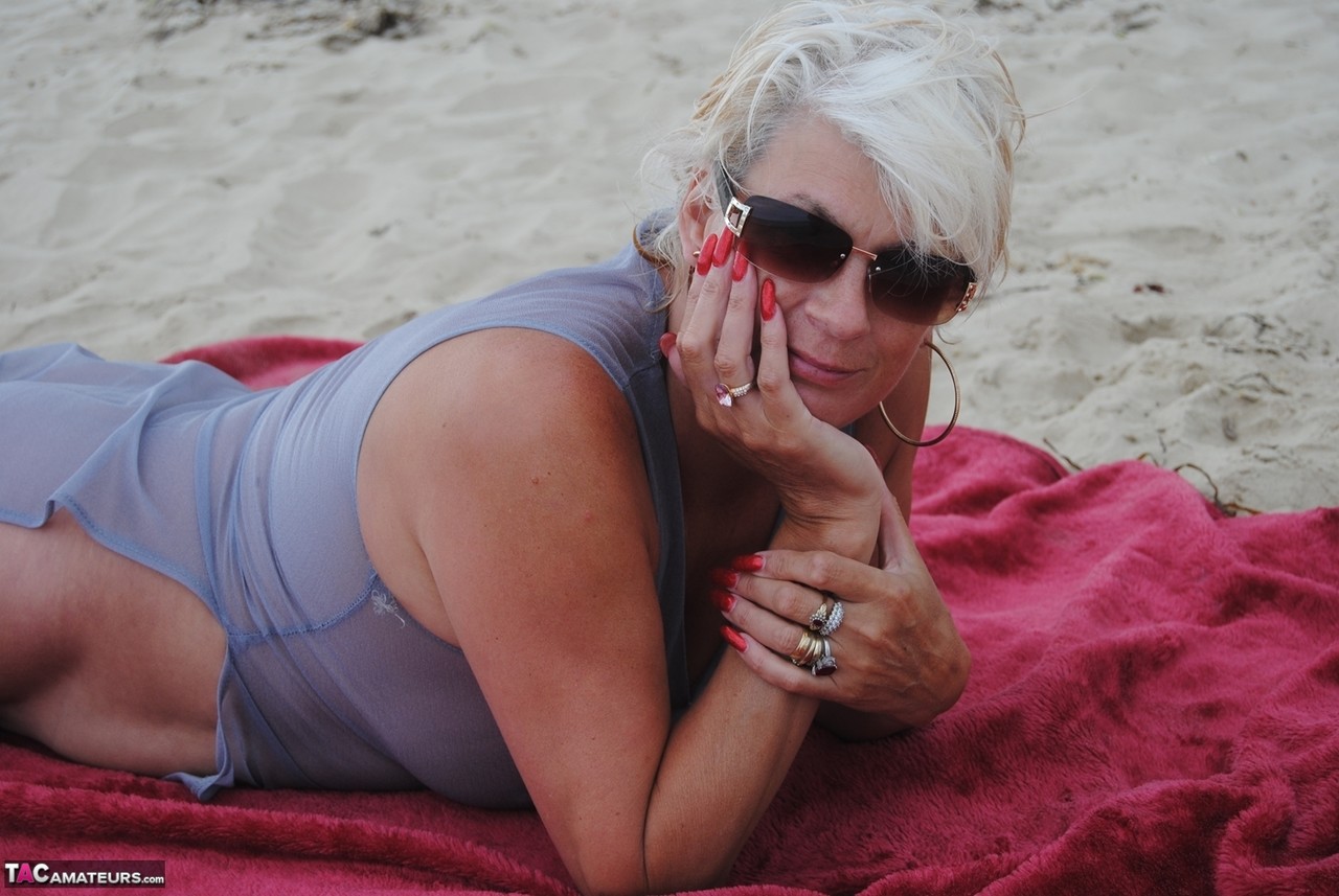 Older blonde amateur Dimonty models at the beach in see thru attire and shades zdjęcie porno #424598768