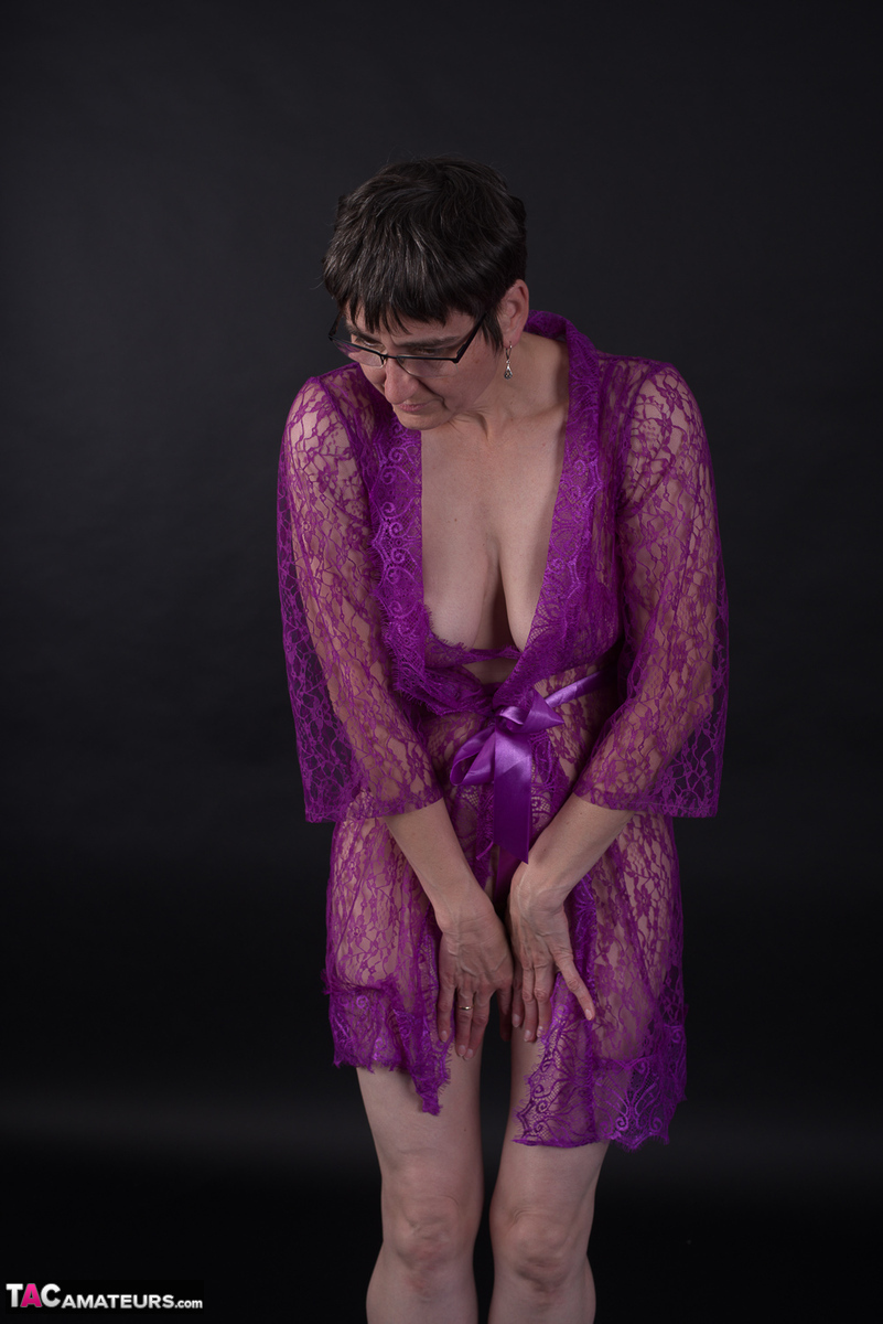 Model with short hair, but while wearing purple lingerie, the older man appears to be sporting short haircuts.