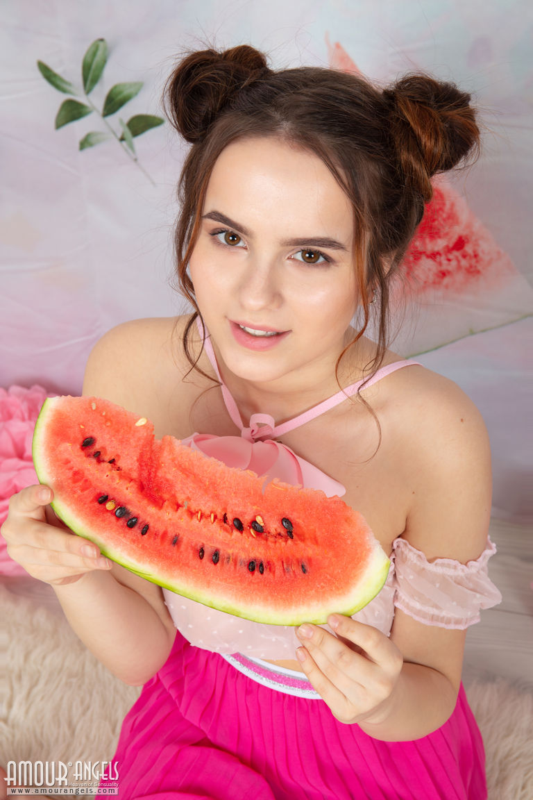 Young looking girl Wendy eats a hunk of watermelon while getting buck naked порно фото #425158781