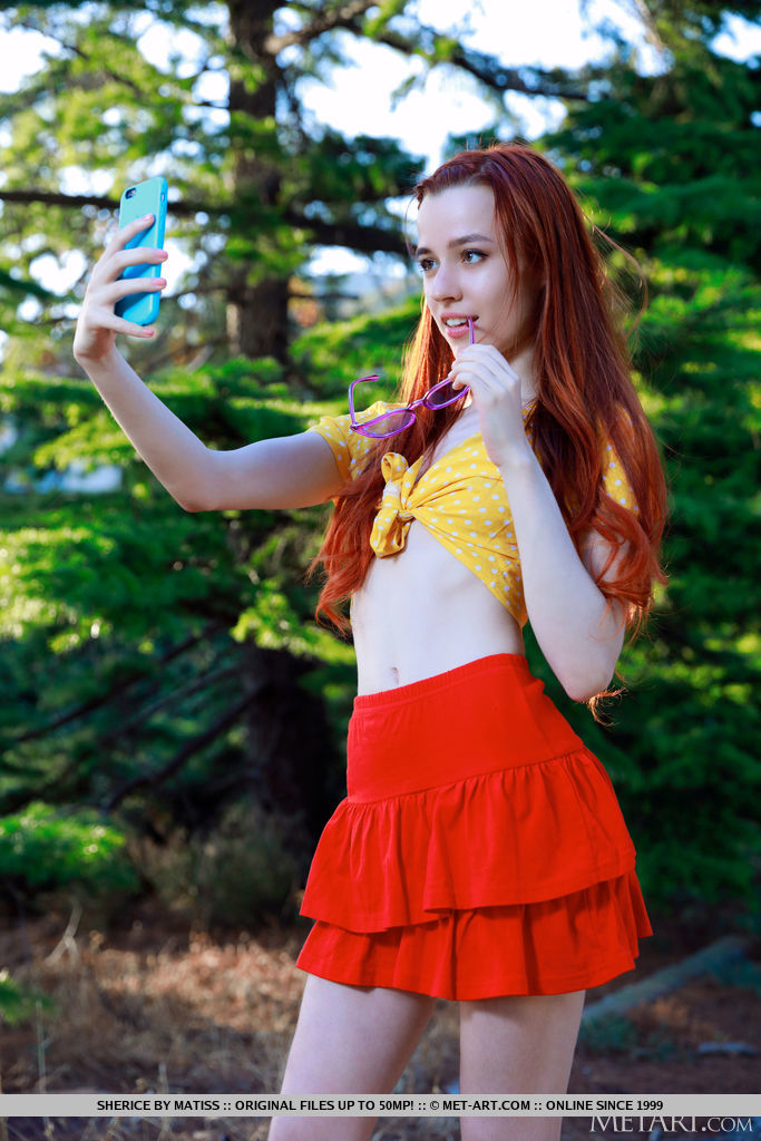 Young redhead Sherice gets totally naked after taking selfies on a forest path foto porno #424480845