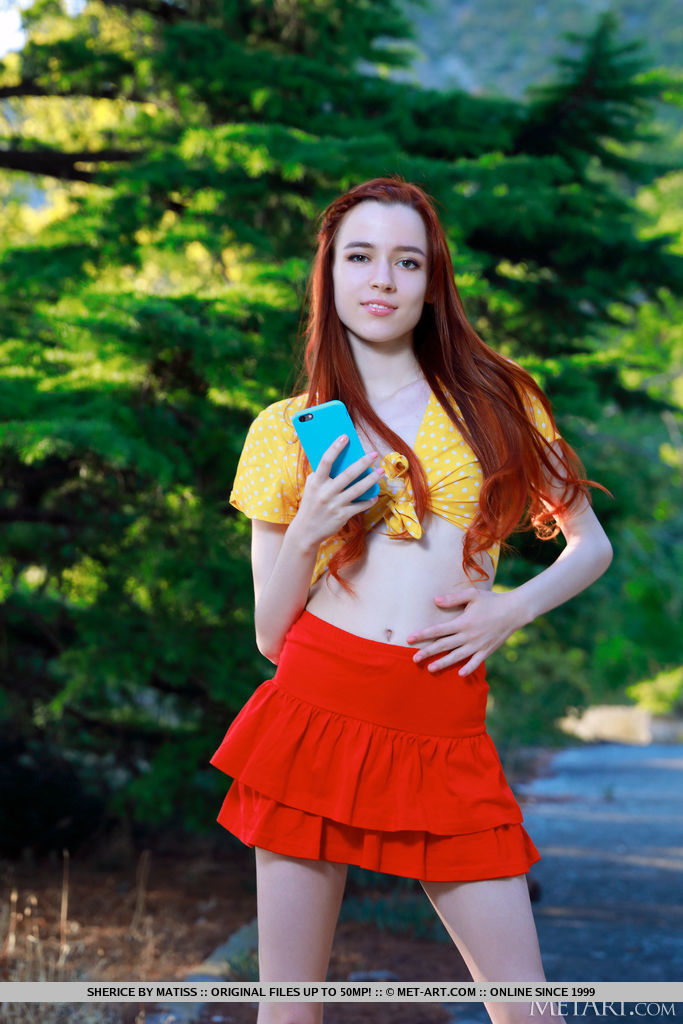 Young redhead Sherice gets totally naked after taking selfies on a forest path foto porno #424480847