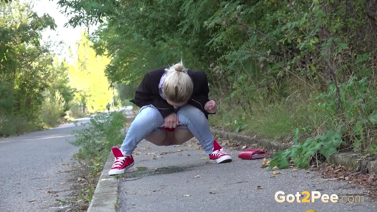 Pretty blonde Di Devi pulls down her jeans to pee on a public sidewalk photo porno #425166333