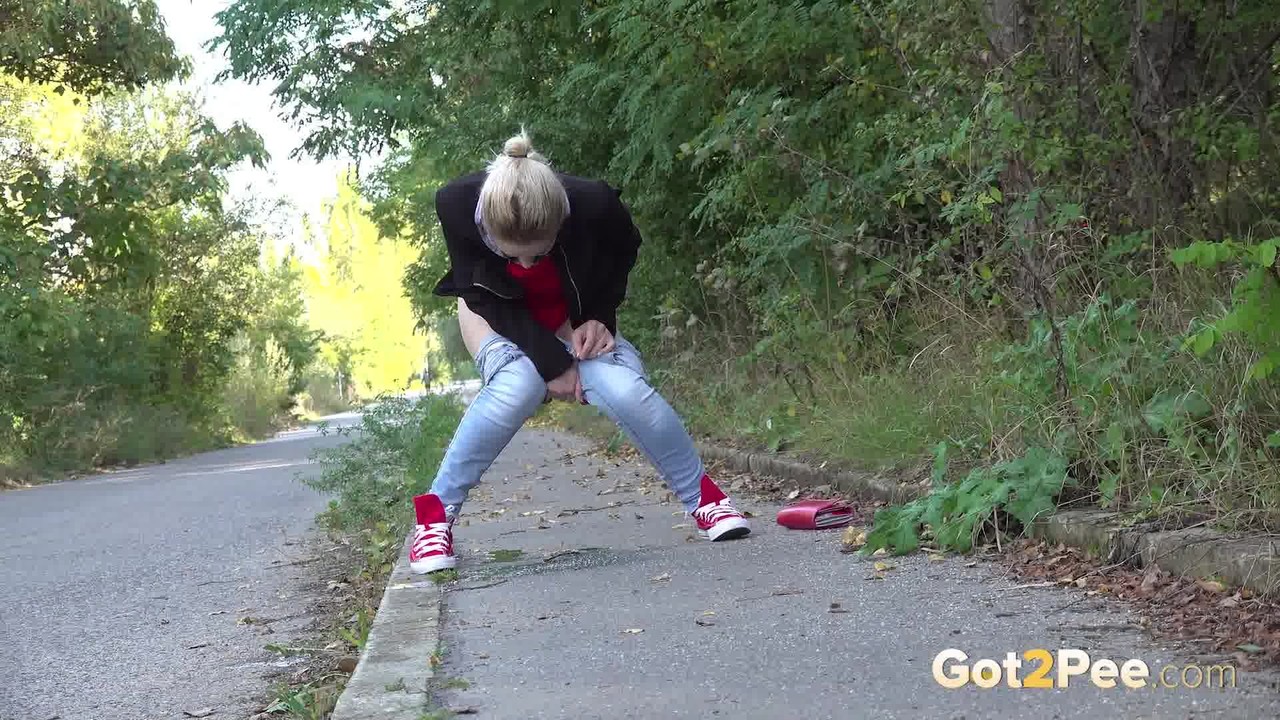 Pretty blonde Di Devi pulls down her jeans to pee on a public sidewalk photo porno #425166336