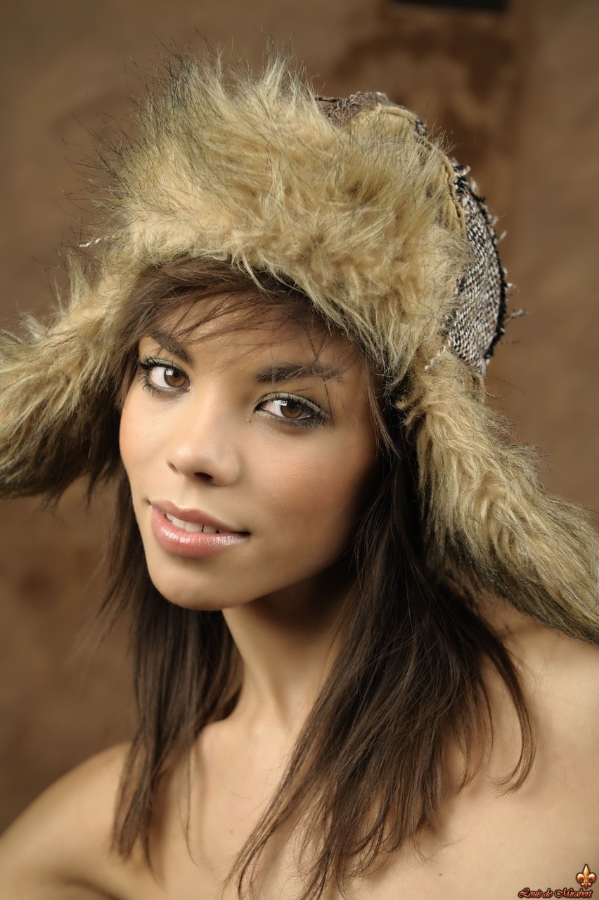 Beautiful girl with a pretty face dons a winter hat during a glamour shoot ポルノ写真 #428254706