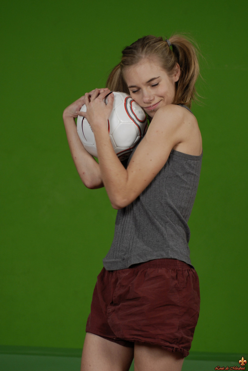 Petite girl Kelly exposes a breast while holding a soccer ball 色情照片 #426703889