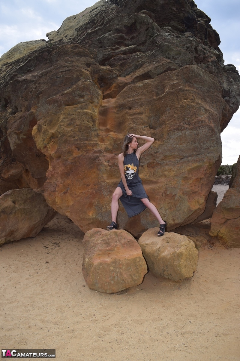 Amateur model exposes her vagina during upskirt action on rust stained rocks photo porno #428194126