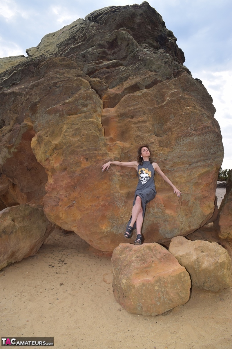 Amateur model exposes her vagina during upskirt action on rust stained rocks photo porno #428194127