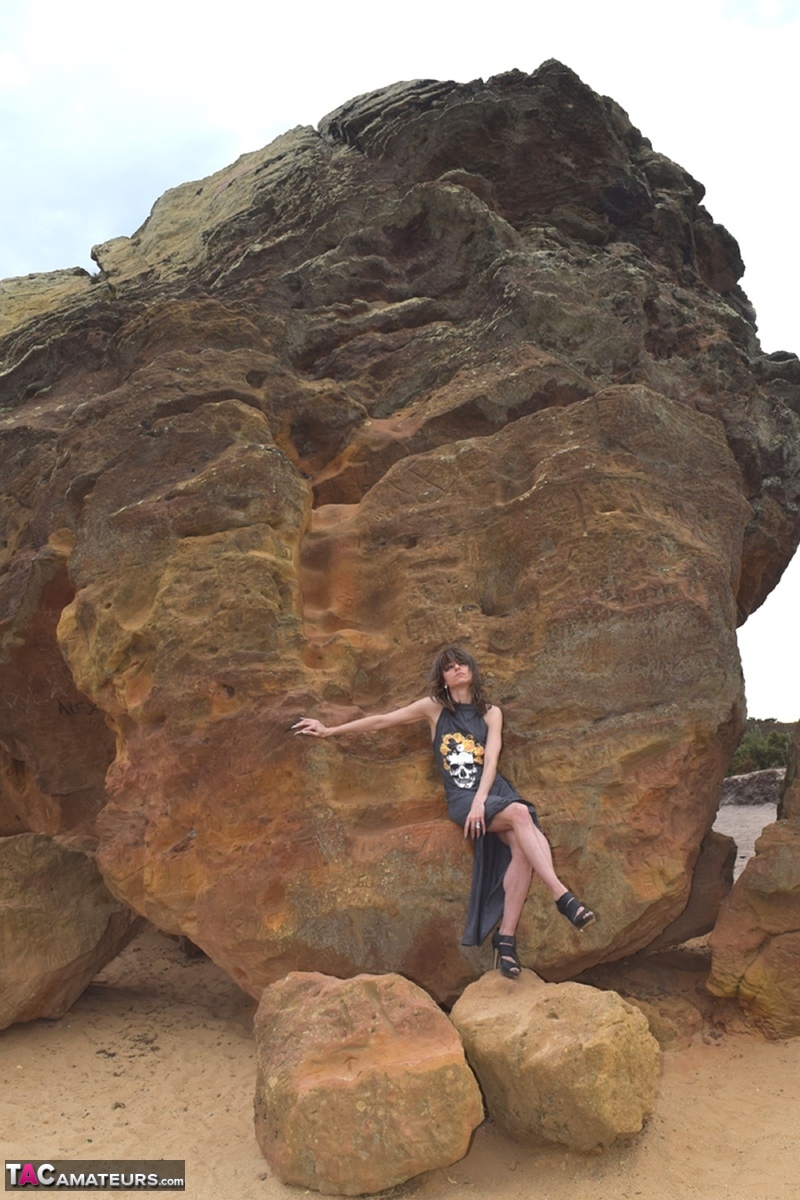Amateur model exposes her vagina during upskirt action on rust stained rocks photo porno #428194132