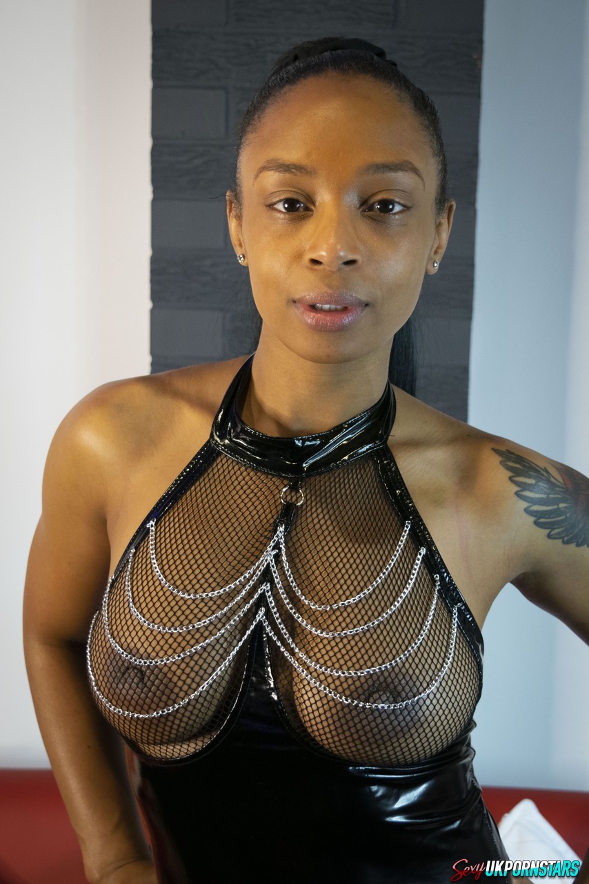 Ebony Model Alicia Rhodes Poses In A See Through Top And Over The Knee Boots