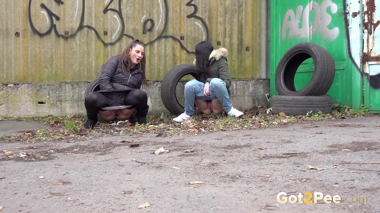 Teen girls Nicolette Noir and Mistika squat to piss behind a building порно фото #425365034