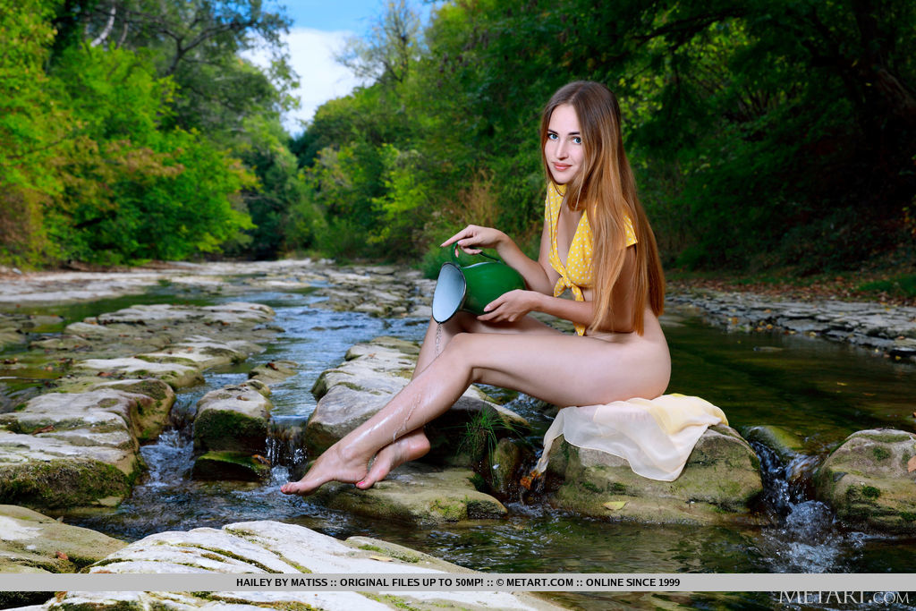 Young redhead Hailey models in the nude upon a rock in a stream порно фото #428769754
