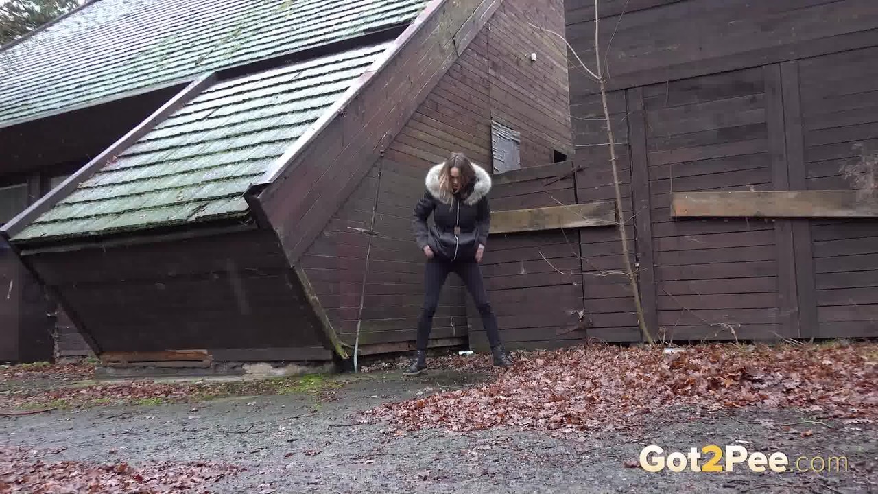 White girl Cynthia Vellons squats to take a piss next to an isolated building photo porno #428803643