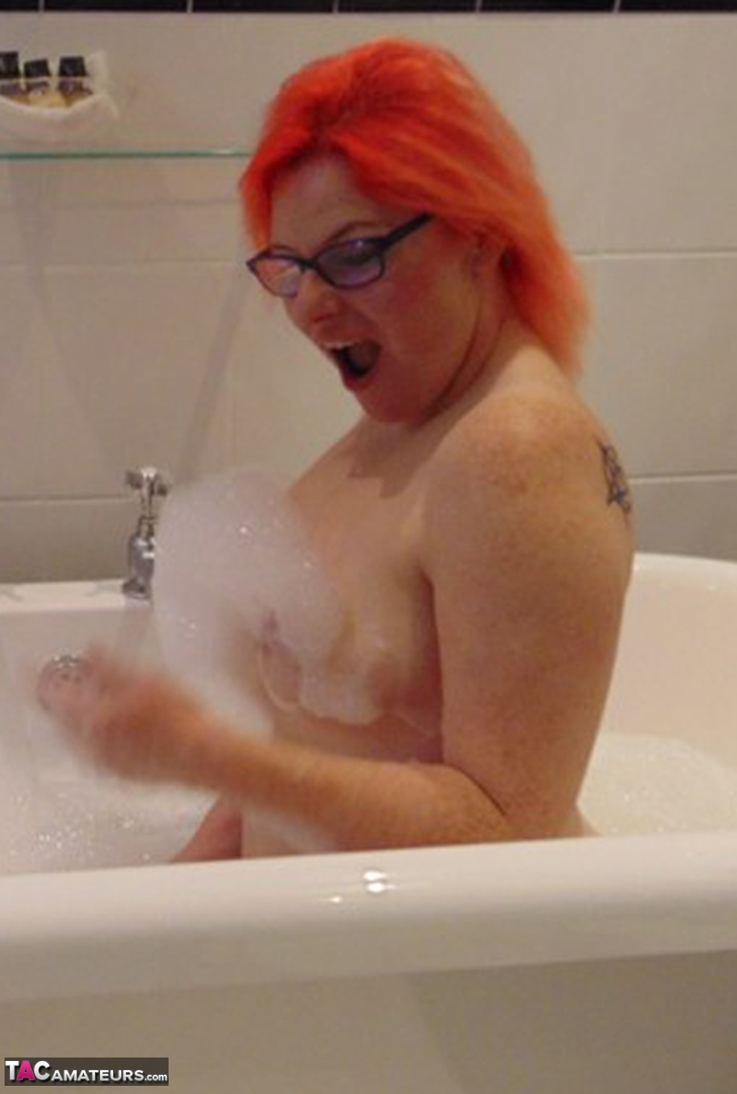 Tattooed amateur Mollie Foxxx takes a bubble bath with her glasses on porn photo #424566831