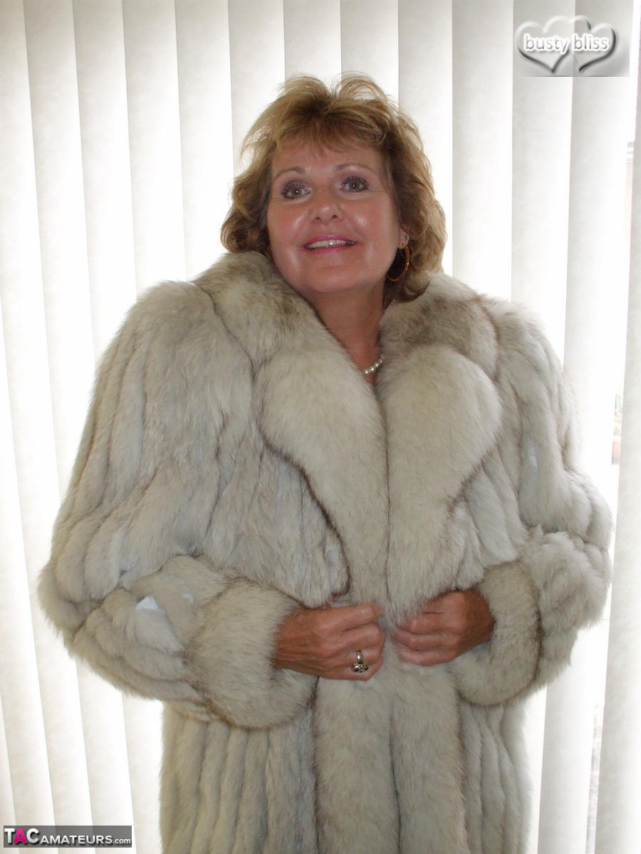 Mature amateur Busty Bliss exposes her tan lined tits while wearing a fur coat porn photo #429077053