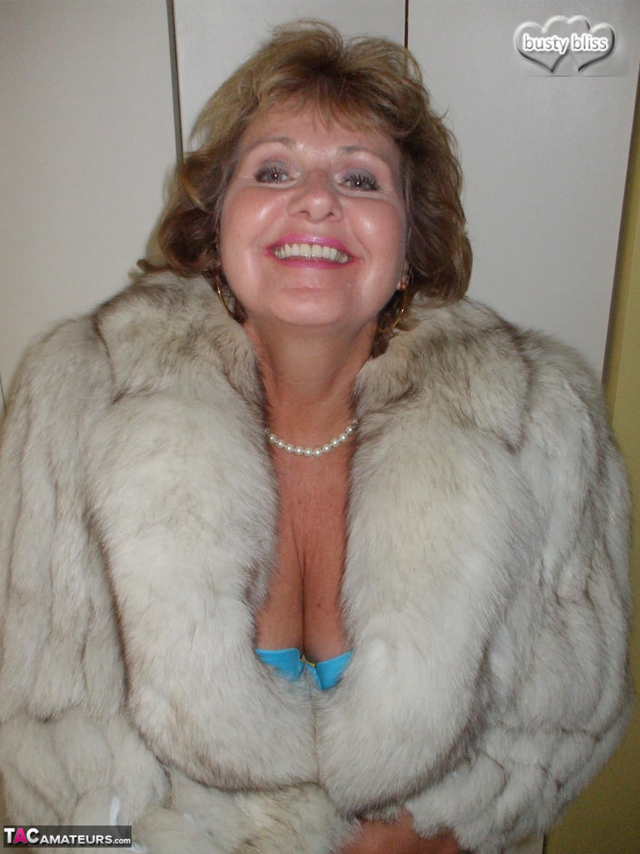 Mature amateur Busty Bliss exposes her tan lined tits while wearing a fur coat porn photo #429077056