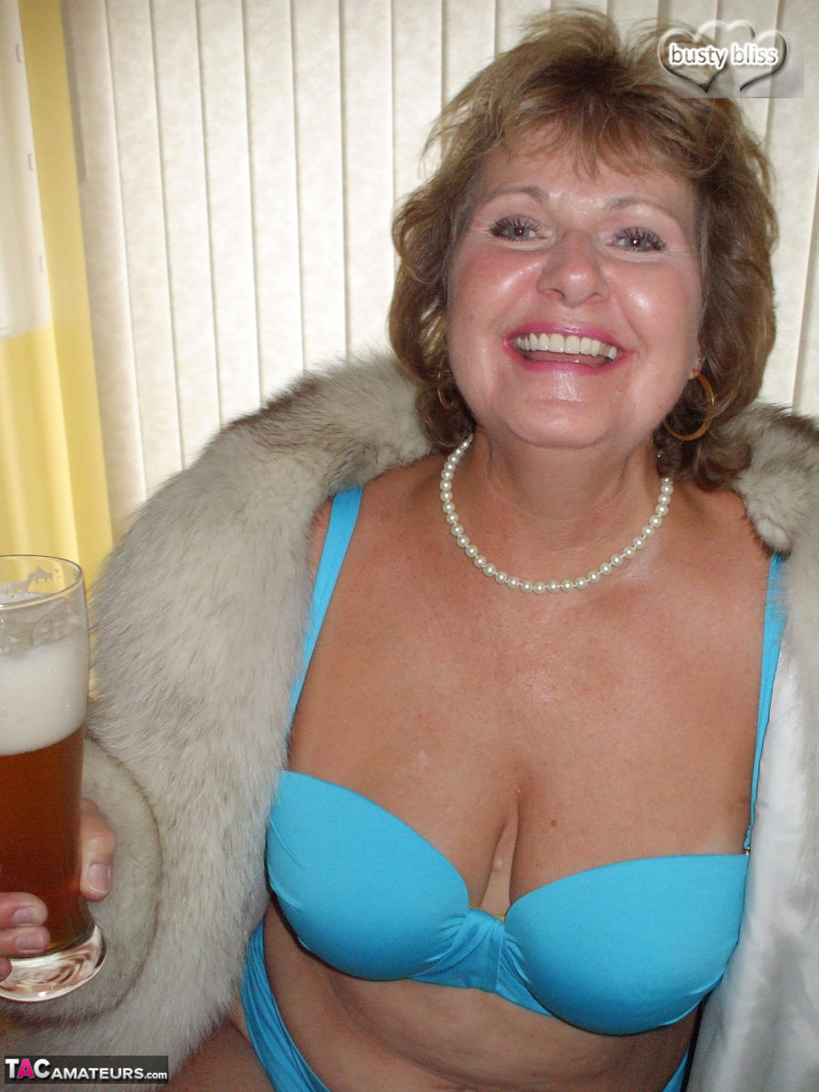 Mature amateur Busty Bliss exposes her tan lined tits while wearing a fur coat porn photo #429077061