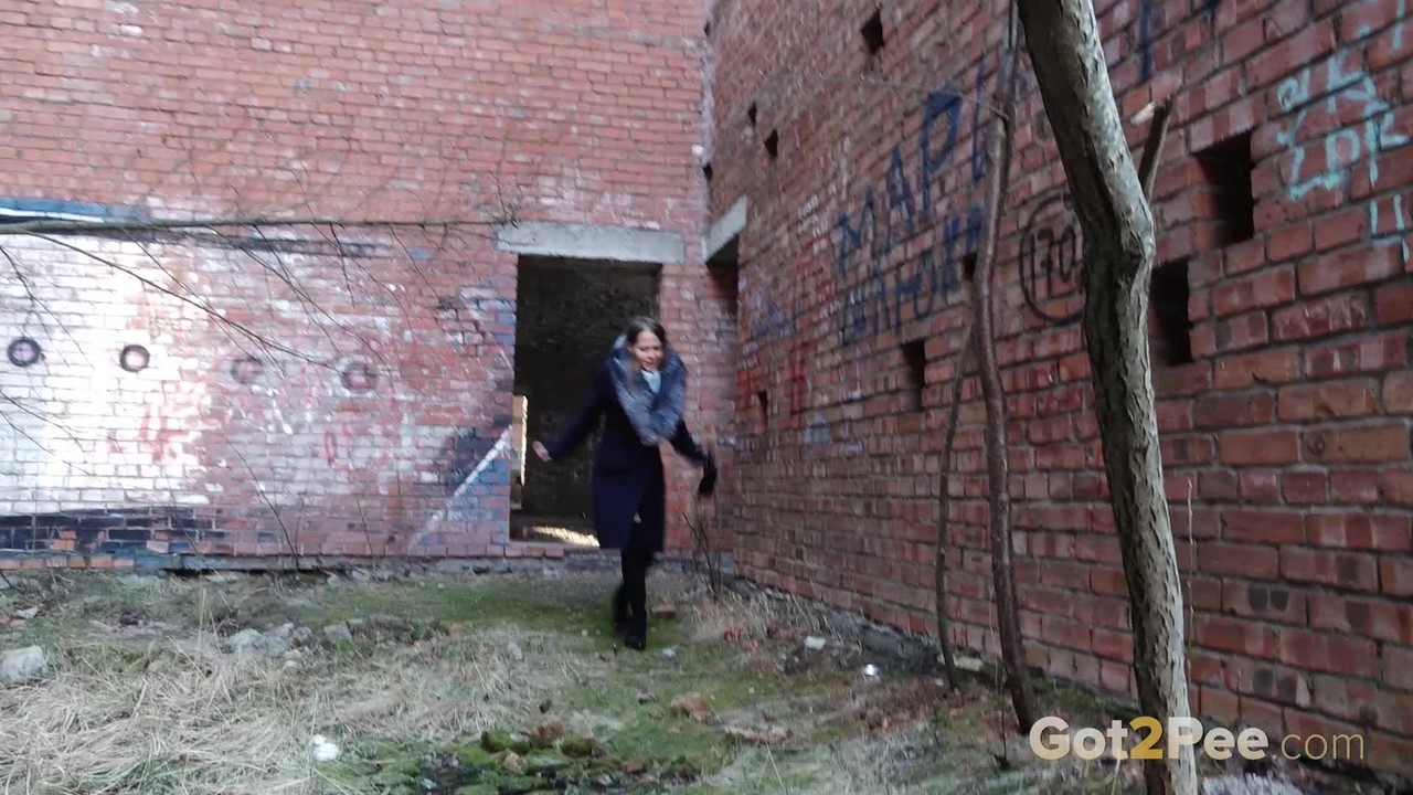Distressed girl Nastya pulls down her tights to pee by an abandoned building foto porno #426454811